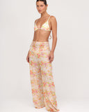 Vista frontal del pantalón mesh Gioia di Sole con estampado floral translúcido.